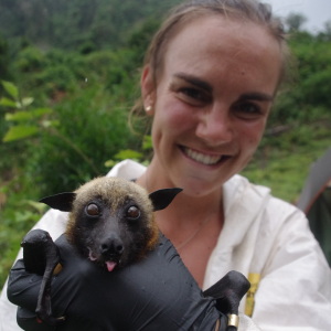 Cara and a Malagasy fruit bat pose in the field