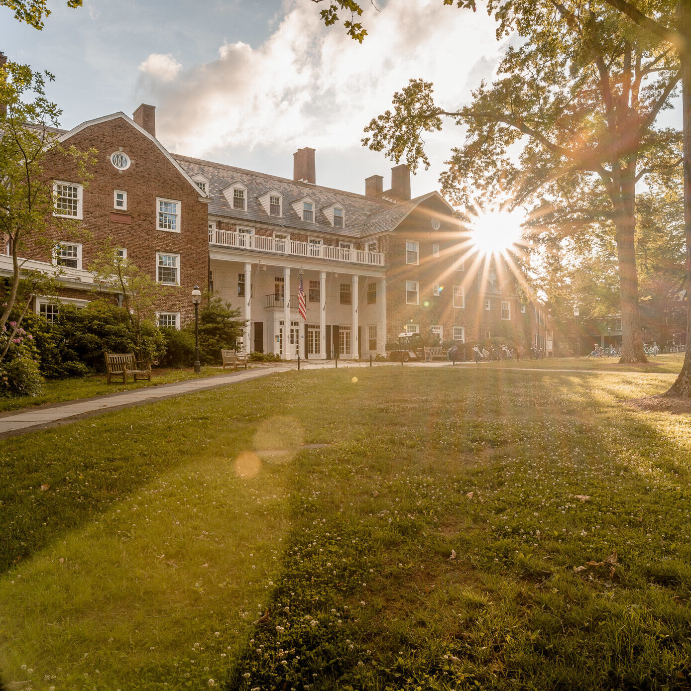 Image with a sun flare in the front of Forbes College.