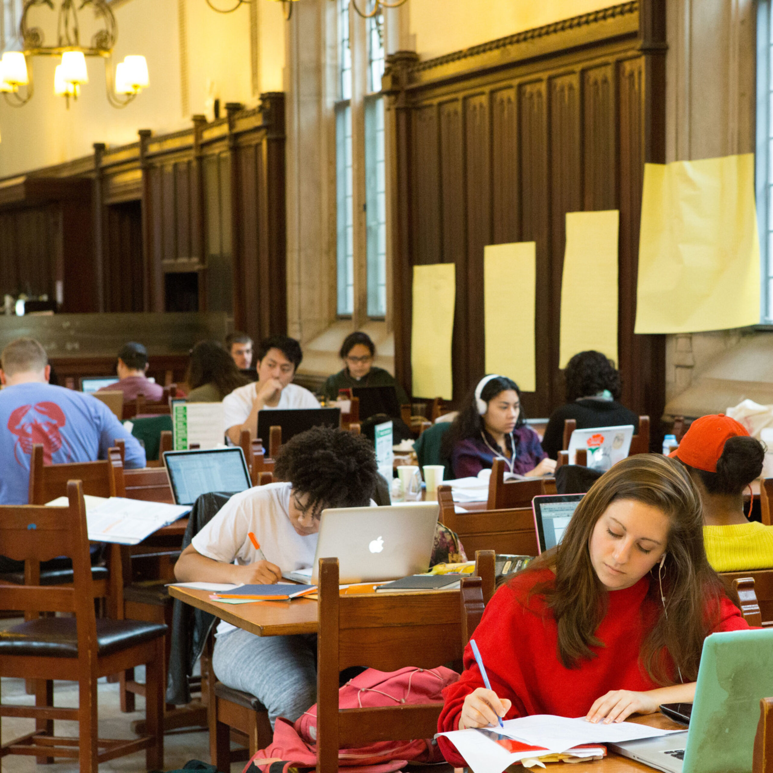 Students sitting in rocky dining hall working on their senior thesis.