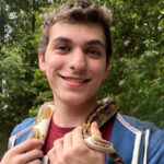 Headshot of Gabriel Ascoli holding snake