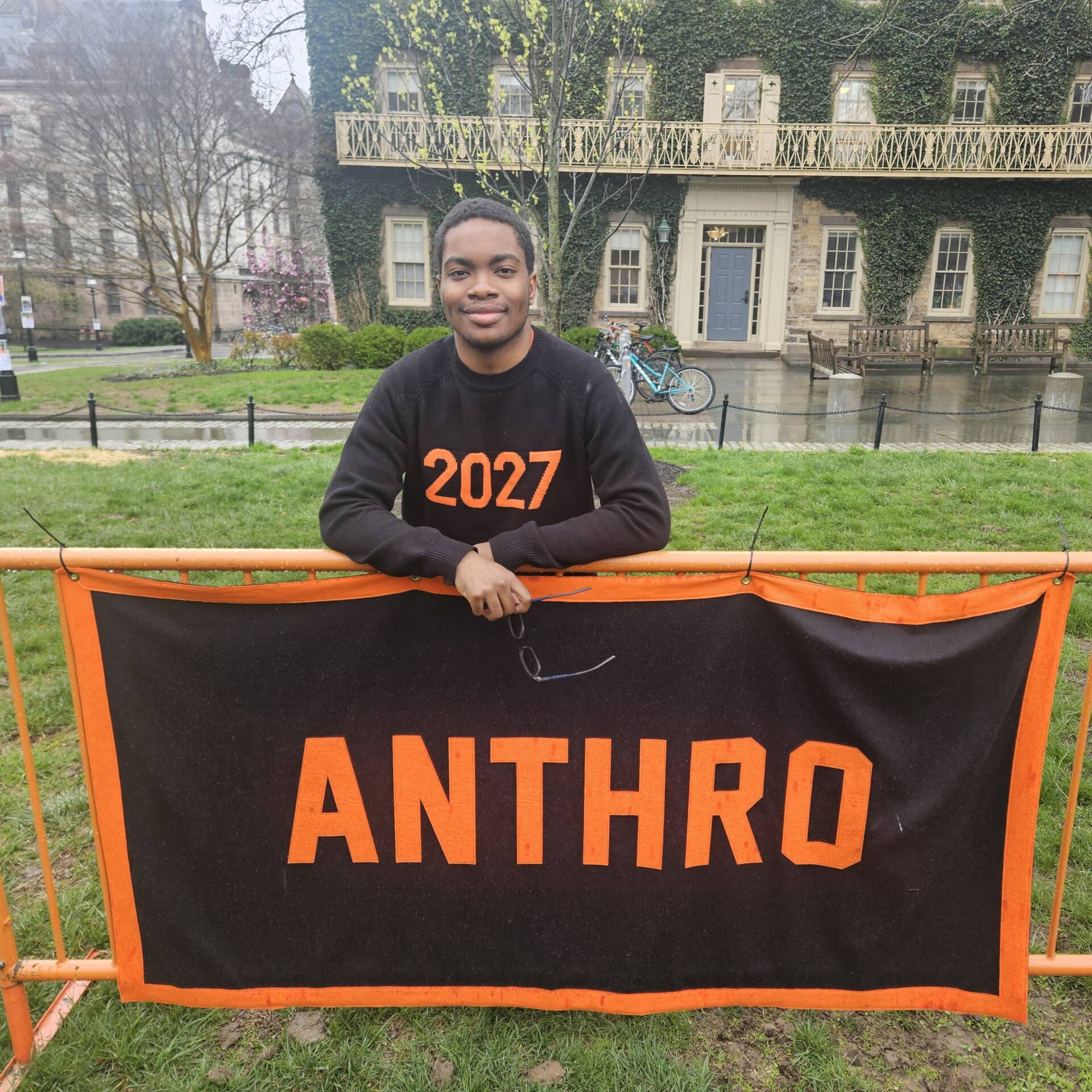 Photo provided by Stanley Stoutamire Jr Stanley Stoutamire standing in front of the Anthropology Department Declaration Day Banner on Cannon Green in front of Morrison Hall.