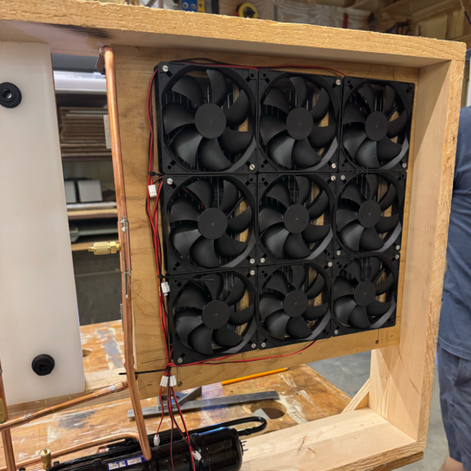 Fan array attached to an evaporator unit within a lab made heat pump.